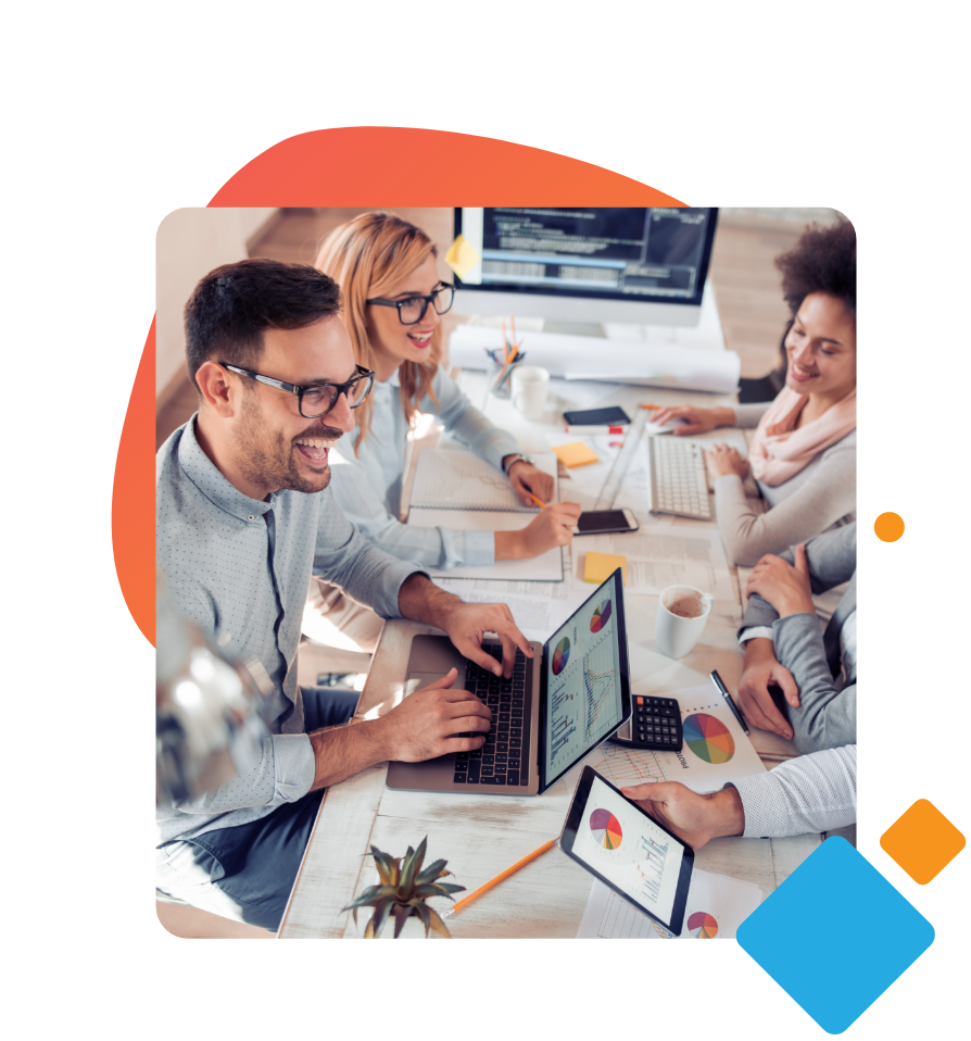 Co-workers sitting around table working